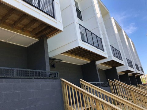 a view of a building with stairs and a balcony