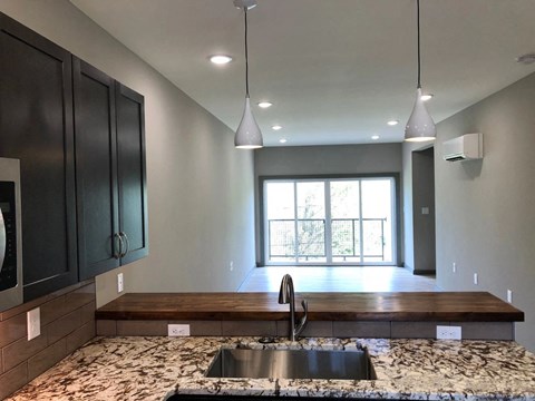 a kitchen with a sink and a window