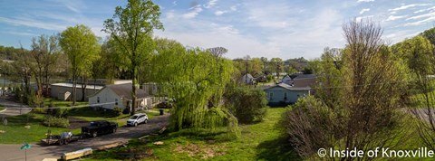 an aerial view of a neighborhood with houses and trees