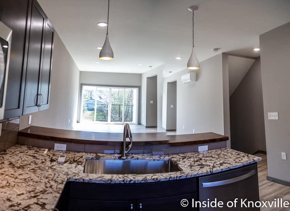 a kitchen with a sink and a counter top