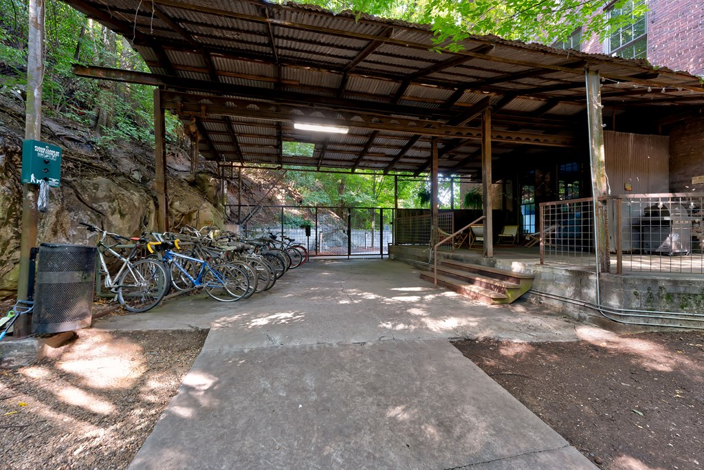 A bicycle parking area under a shelter.