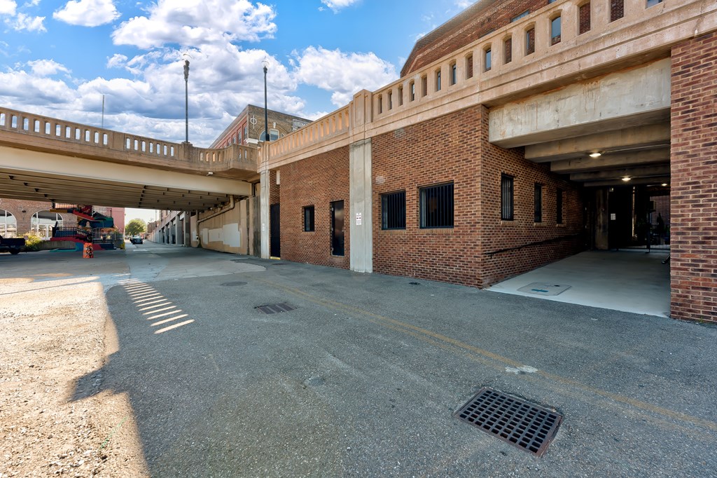 A parking garage with a clear sky in the background.