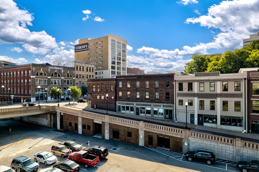 A parking lot with cars and a building with a sign that says "St. Croix's".