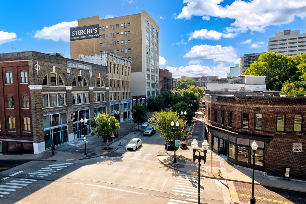 A city street with a Sterchi's building in the background.