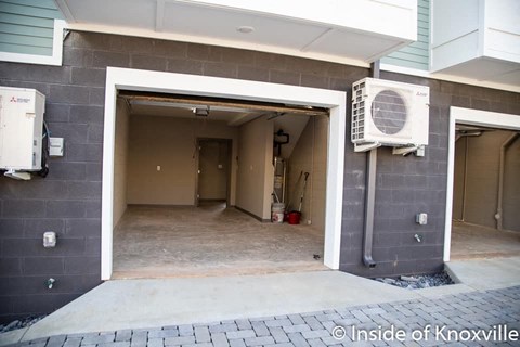 an empty garage with a air conditioner on the wall