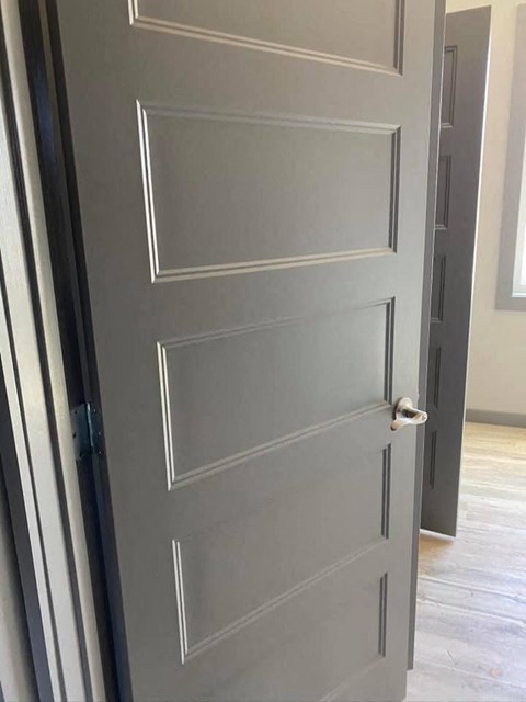 a white door with a door knob on it