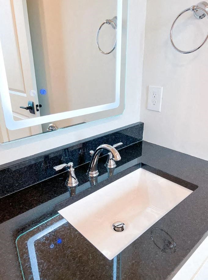 a bathroom with a sink and a mirror