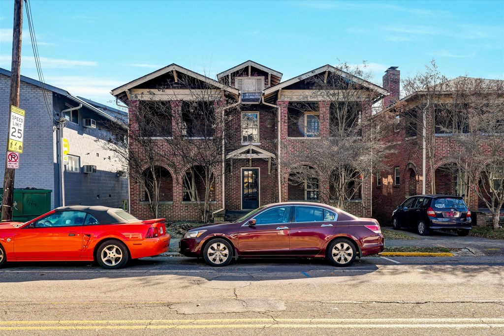 a house with cars parked in front of it