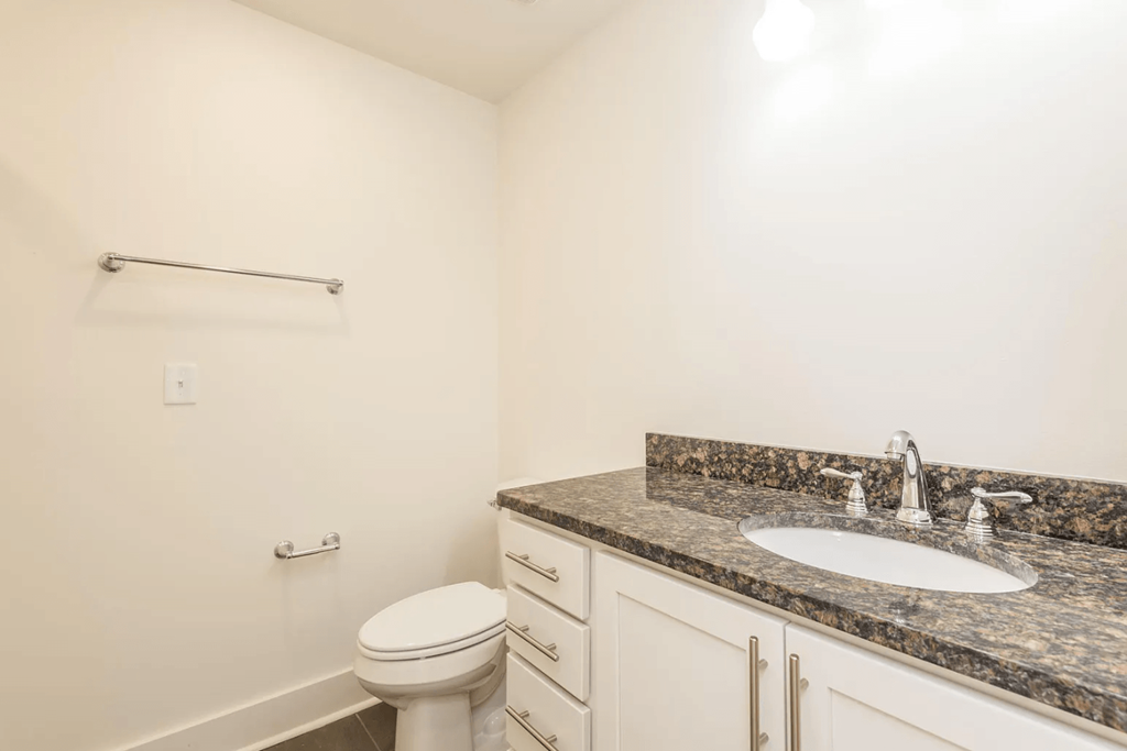 a bathroom with a toilet sink and bathtub
