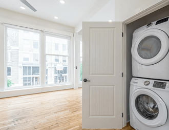 a laundry room with a front load washer and dryer