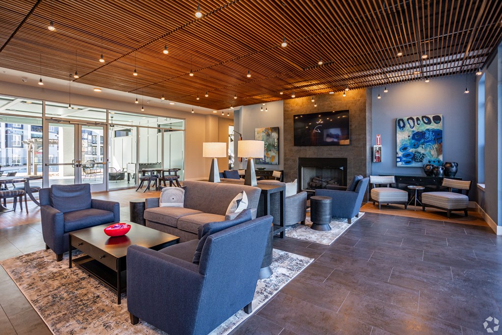 A living room with a fireplace and a television.