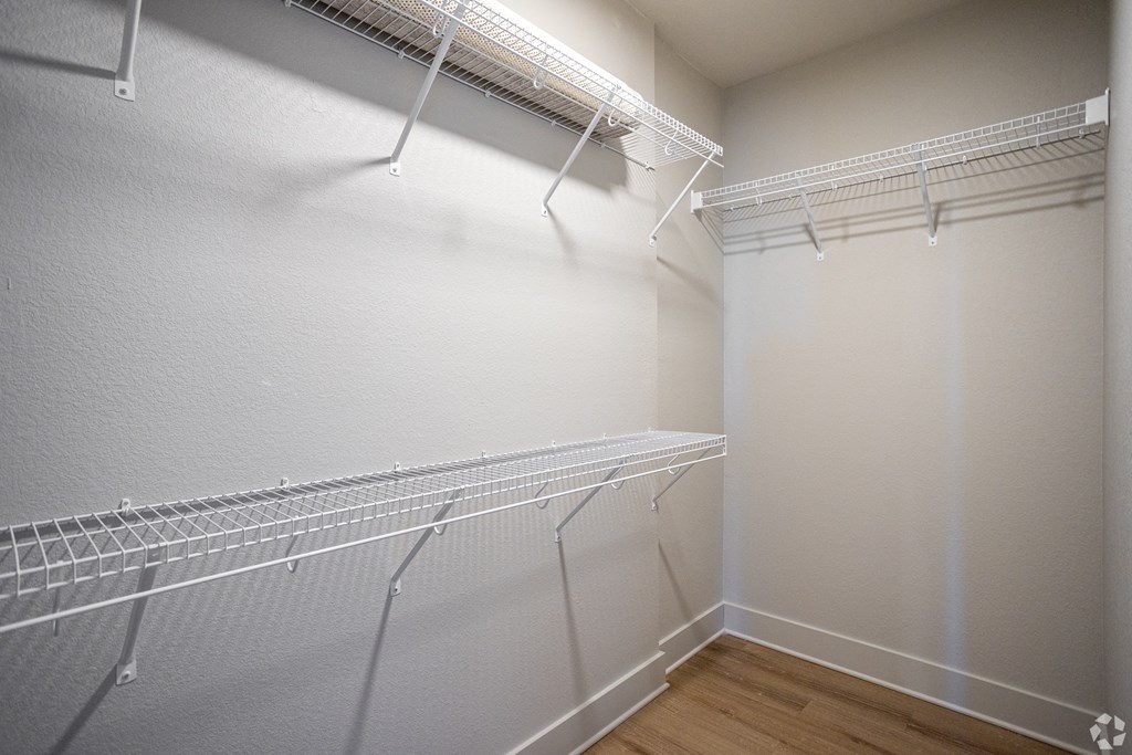 Empty white shelving unit in a room.