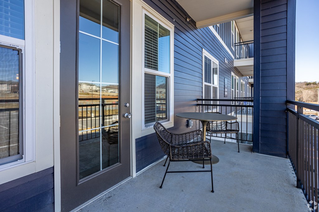 A patio with a table and chairs is shown.