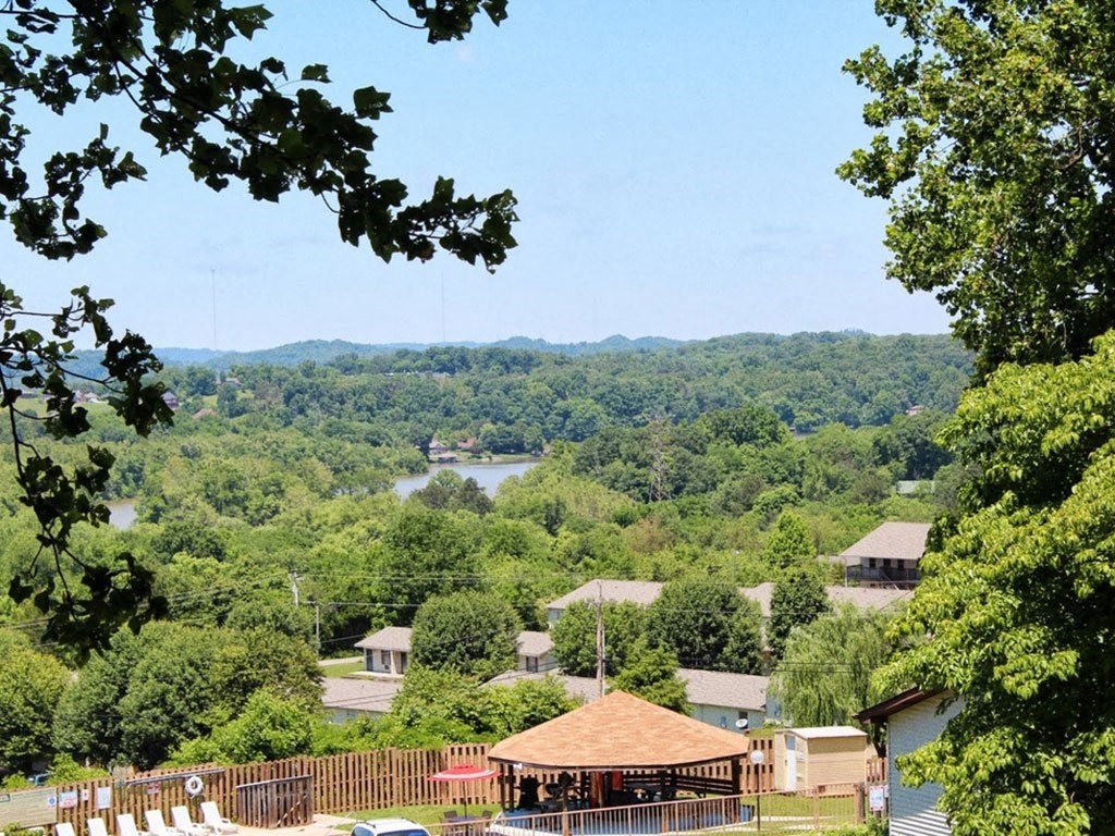 the view of the neighborhood and the river from the deck of the house