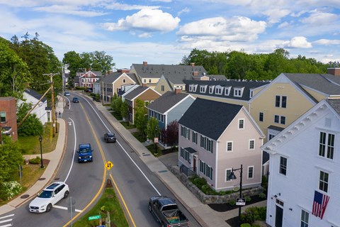 an aerial view of a street in a small town