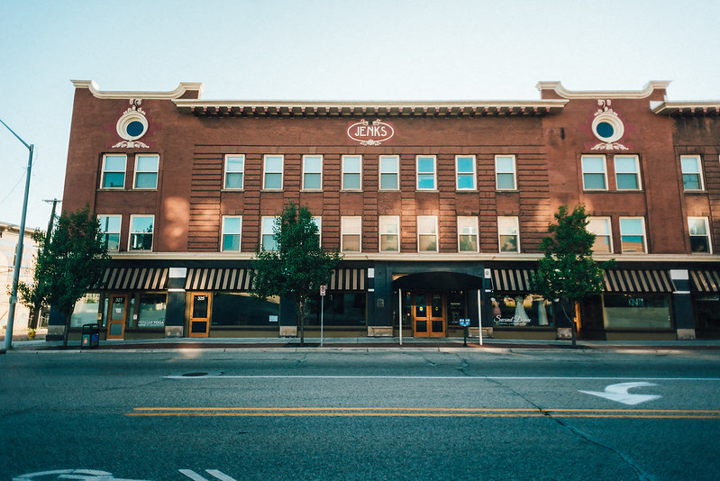 a large brick building on the side of a street