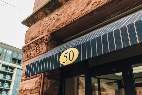 a sign on the front of a store with a 50 on it