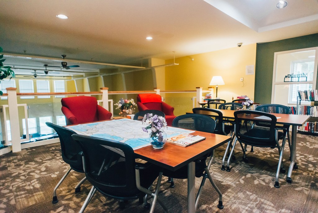 Reflections: A Senior Housing Community community room with multiple seating