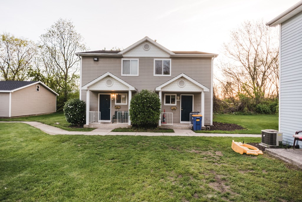 apartment community duplex beige siding white trim