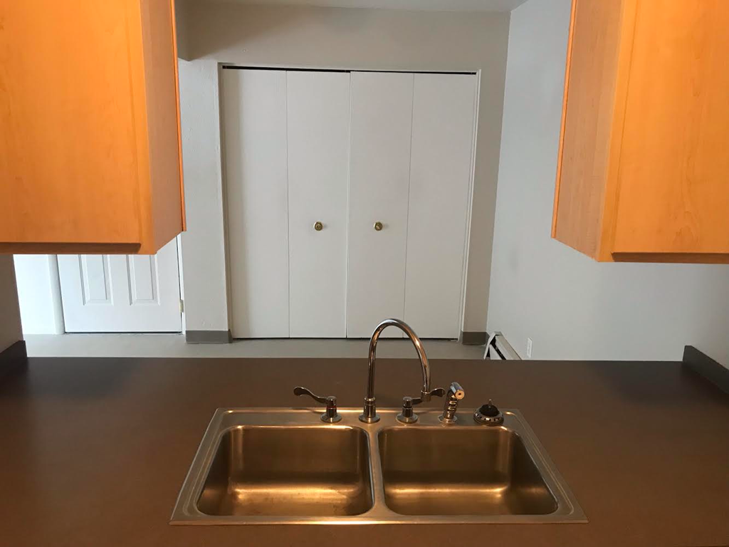 Galley kitchen view to dining room