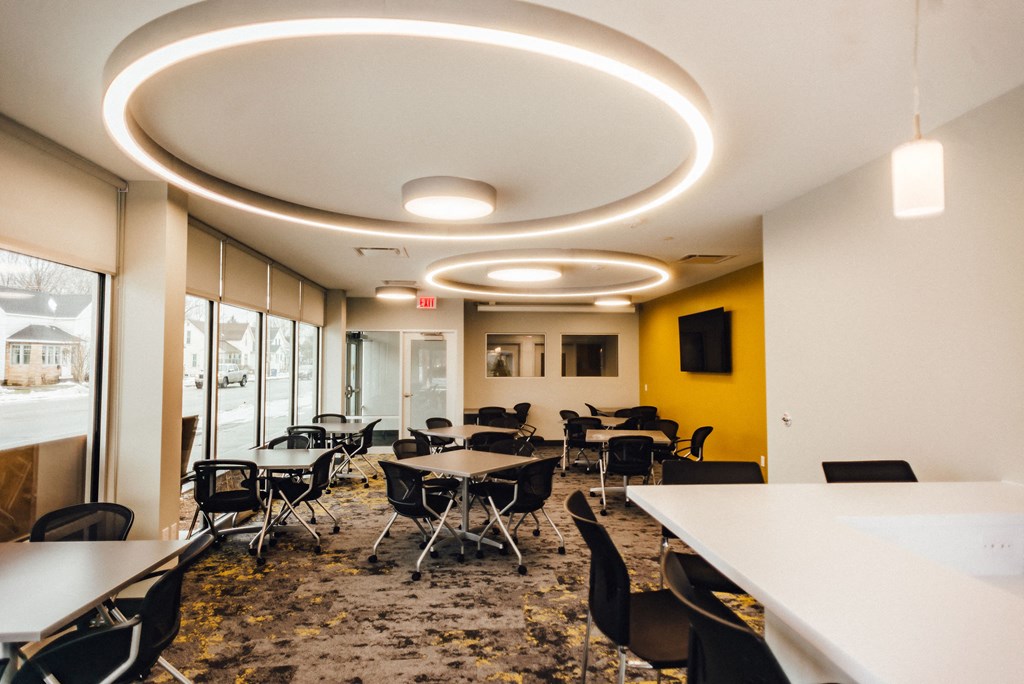 community room with seating modern light fixtures