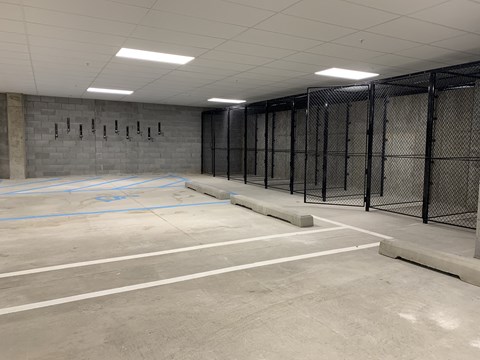cement garage with black storage cages