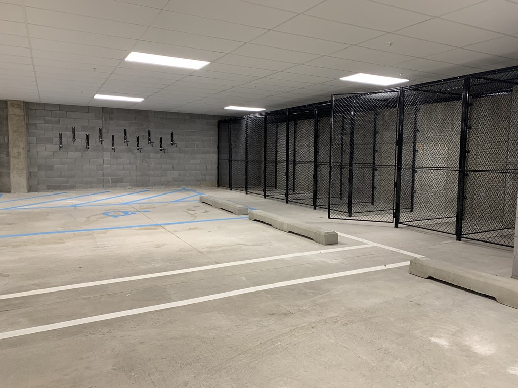 cement parking garage with storage cages