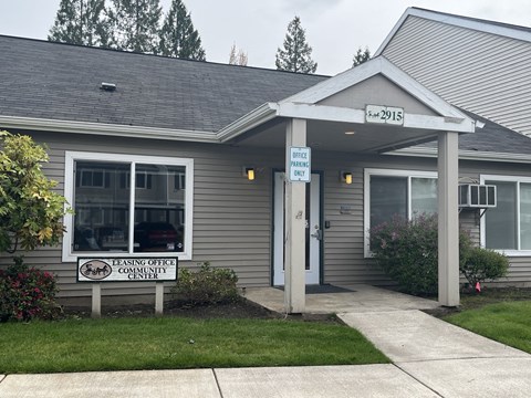 A building with a sign that says Leasing Office Community Center.