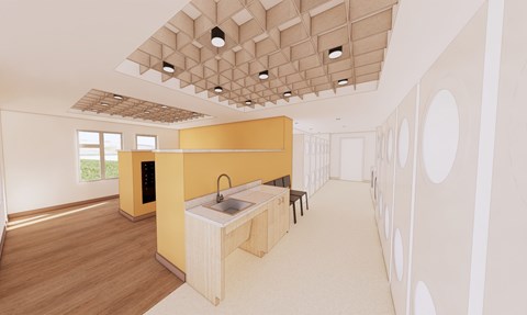 A modern kitchen with a yellow counter and a wooden floor.