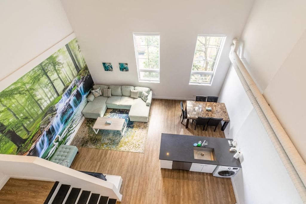 an aerial view of a living room with a couch and a table