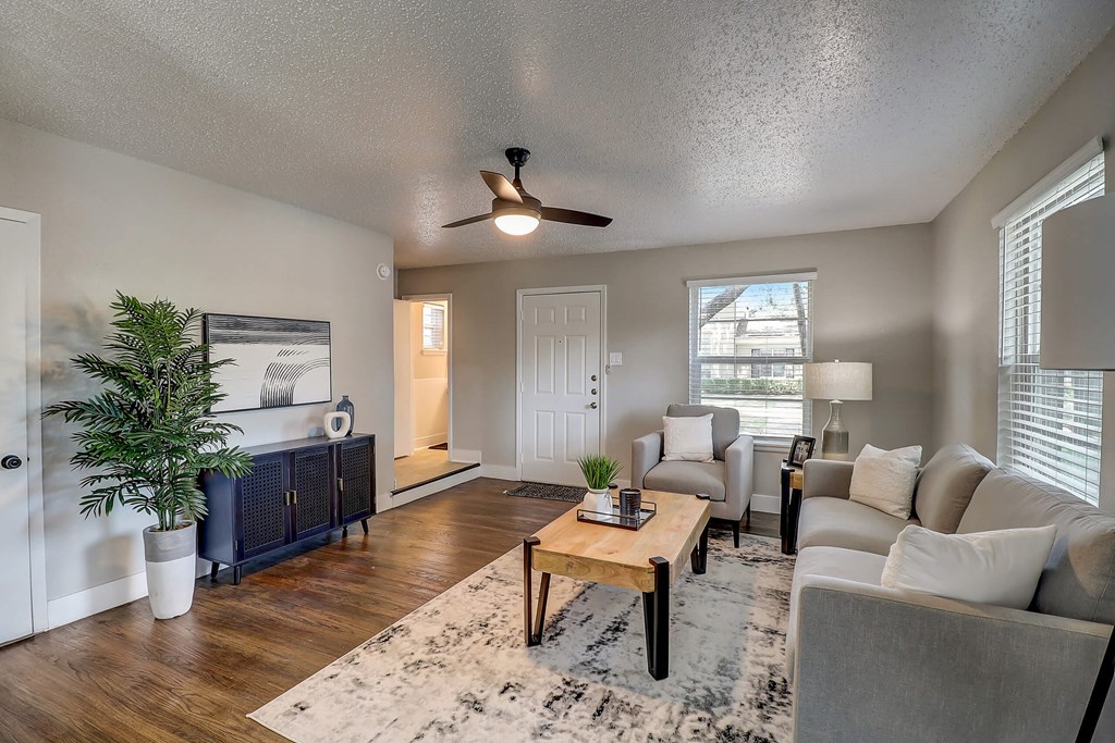an open living room with a couch and a table