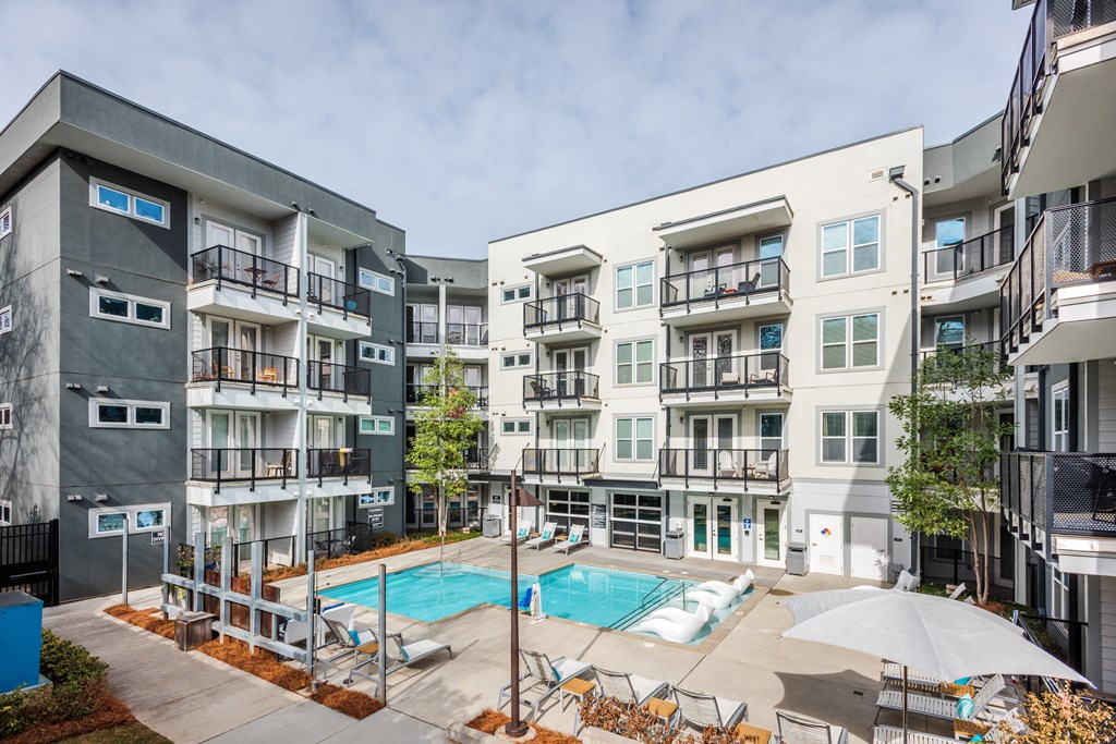 an apartment building with a pool and a swimming pool