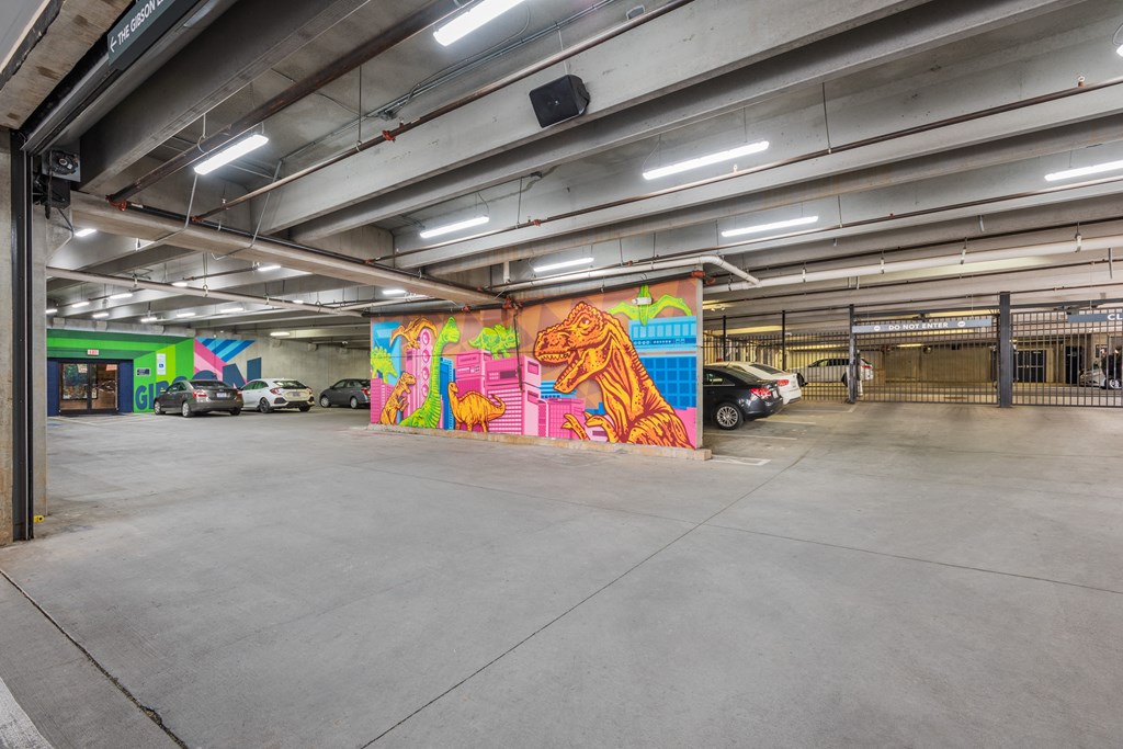 a mural in the middle of a parking garage