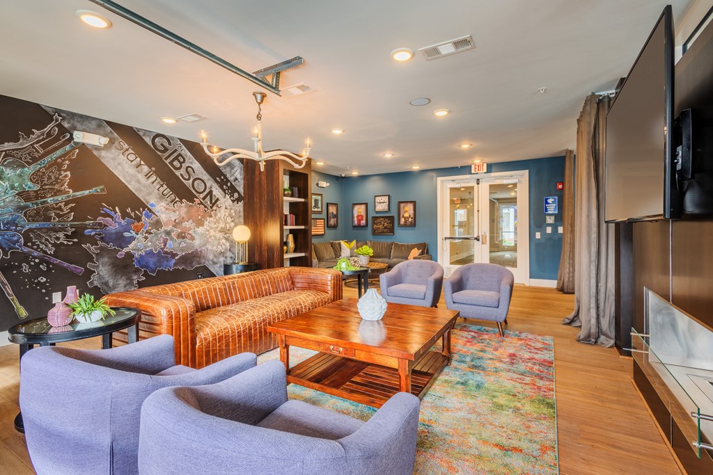 a living room with couches and chairs and a table