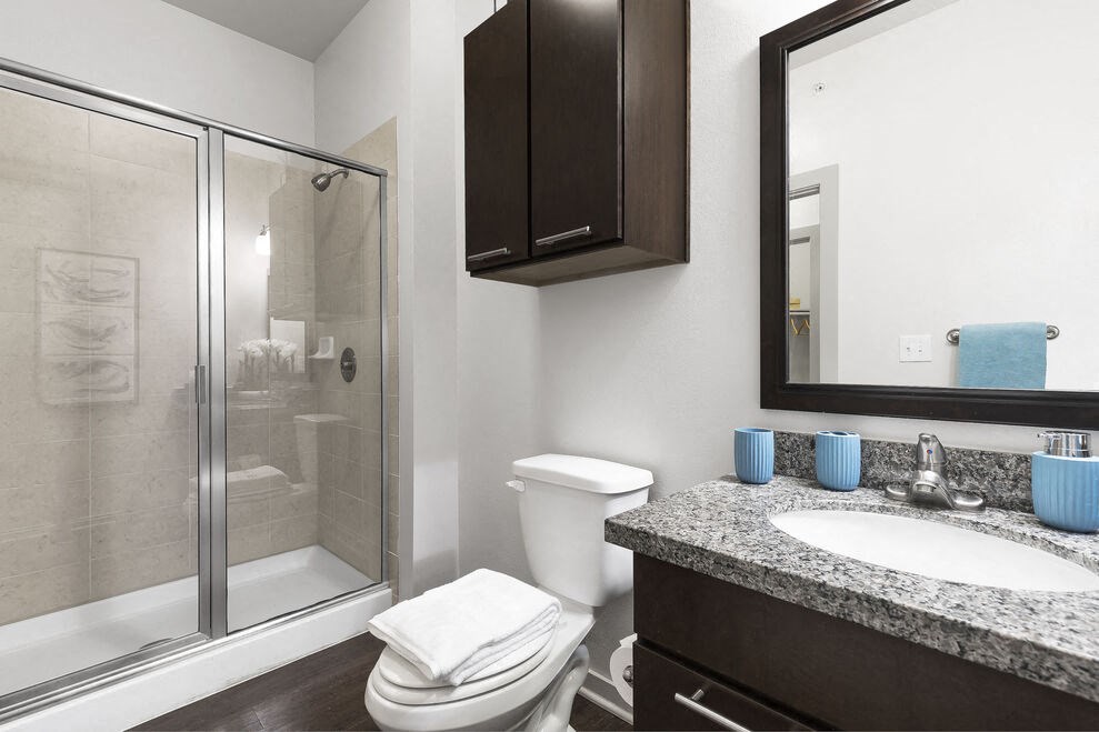 a bathroom with a sink toilet and shower at 95twenty Apartments, Austin, TX, 78717