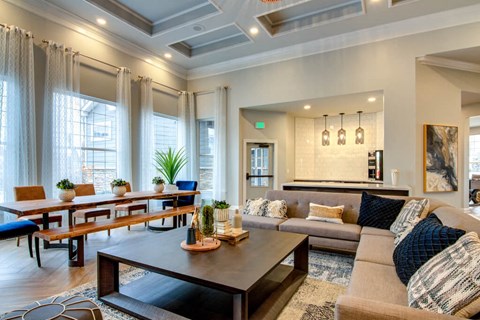 a living room filled with furniture and a large window