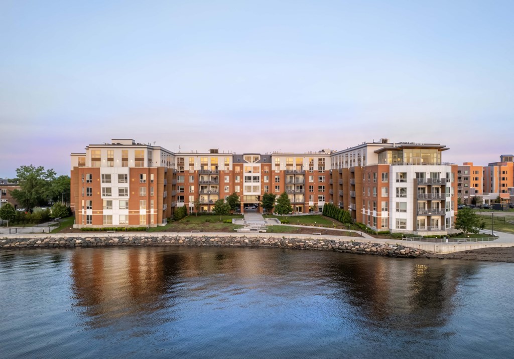 a building with a river in front of it