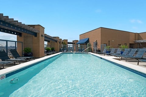 A long rectangular pool with a slide in the middle.