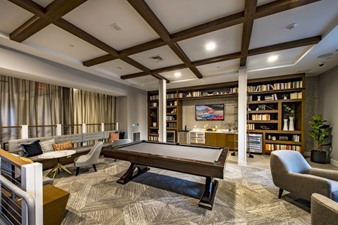 a games room with a billiards table