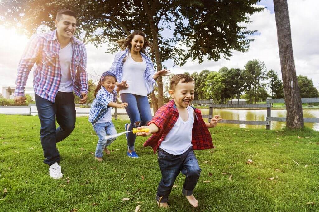 a family playing in the park