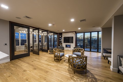 community lounge filled with furniture and a large wrap around balcony