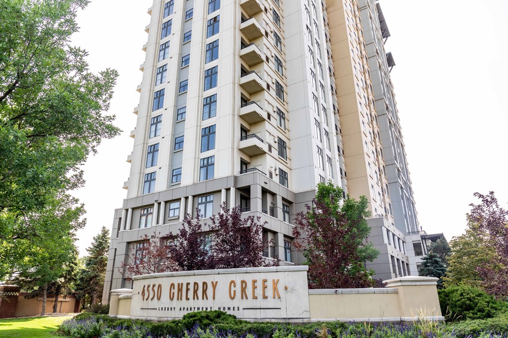 A tall building with the name 4500 Cherry Creek on a sign in front of it.
