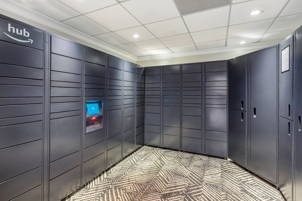 A row of dark grey lockers with a sign that says hub on the wall.