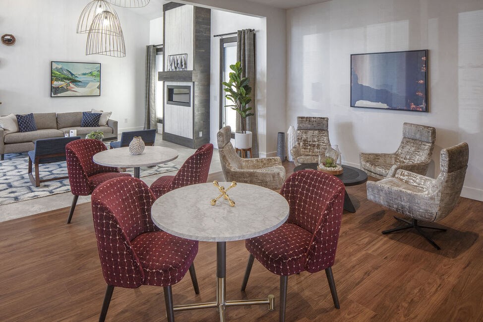 a living room filled with furniture and a flat screen tv