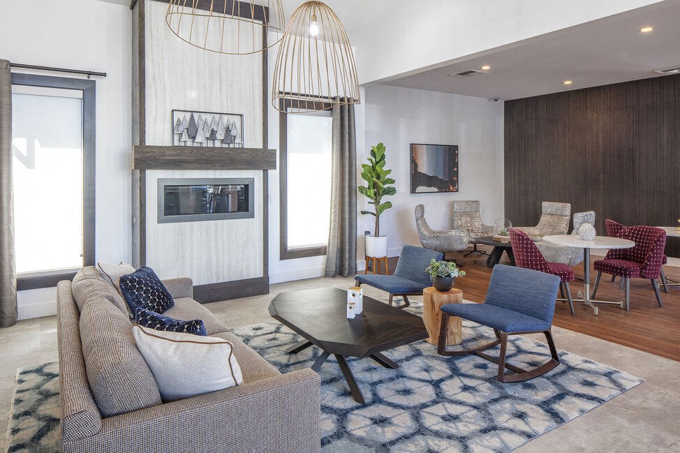 a living room filled with furniture and a fire place