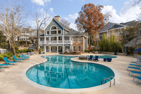 A large house with a pool in the backyard.