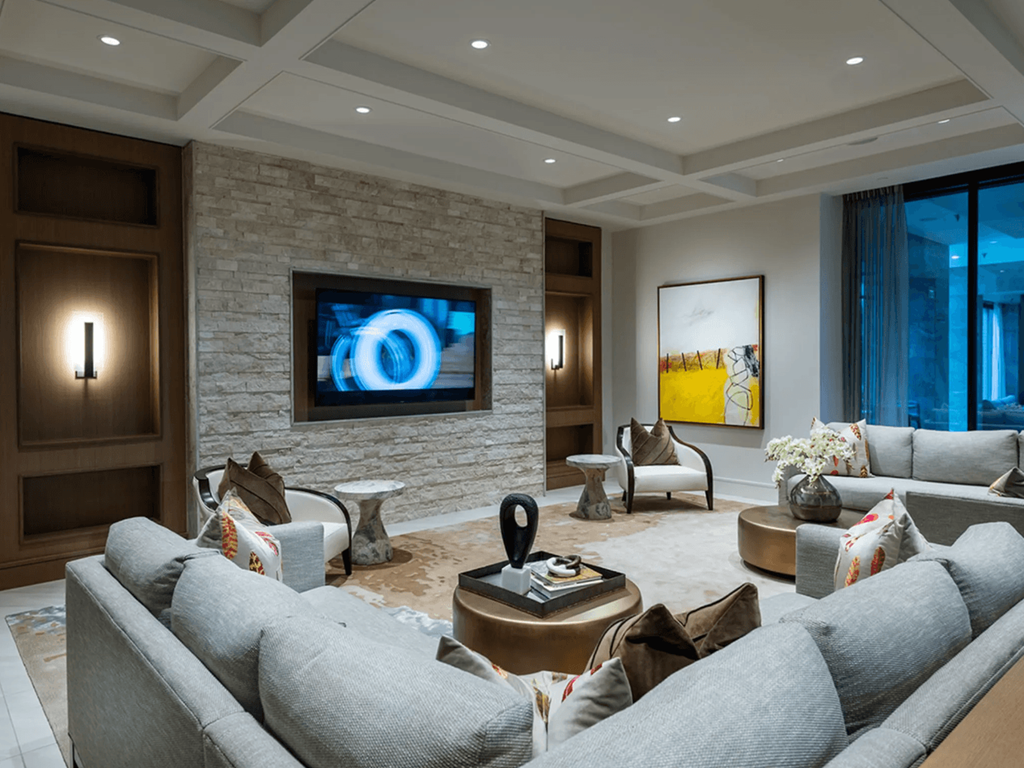a living room with couches and a tv on the wall