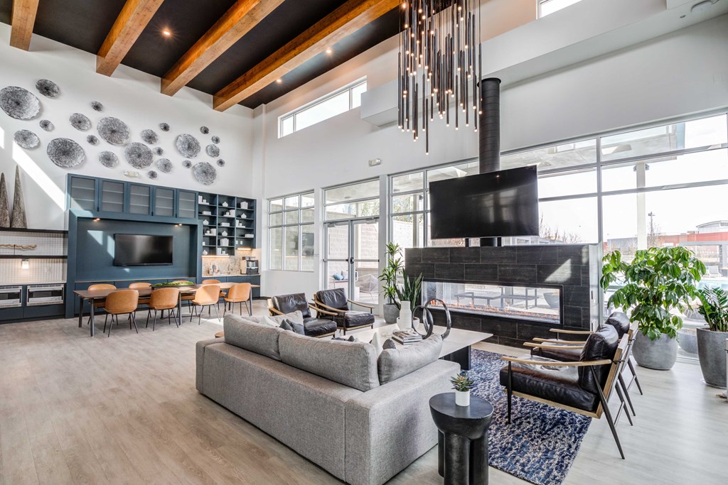 a living room filled with furniture and a large fireplace