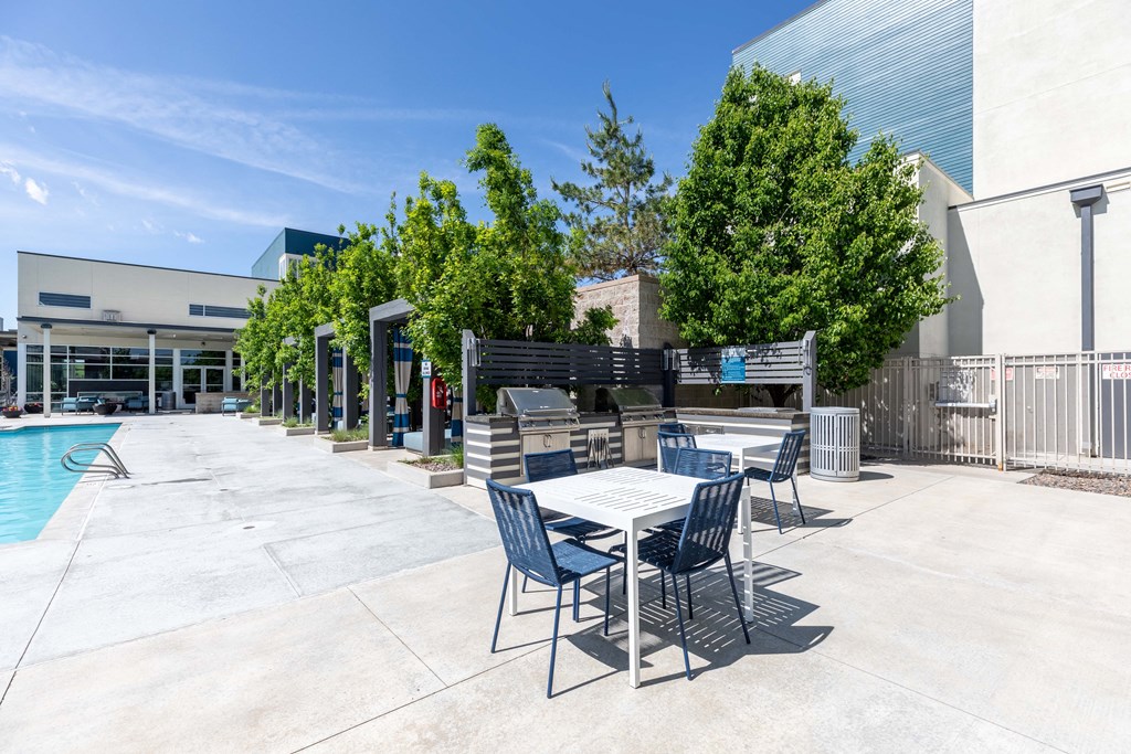 patio with tables near pool