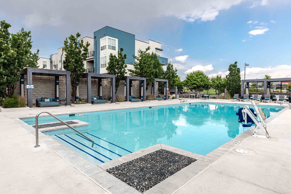a swimming pool with a building in the background